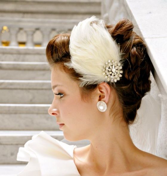 Feathers add vintage elegance to an understated wedding gown. 