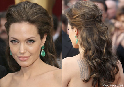 We love everything about Angelina's hair. Here, she depicts a down hairstyle that is wonderfully voluminous. Paired with an elegant, simple wedding gown, this look would be stunning. 