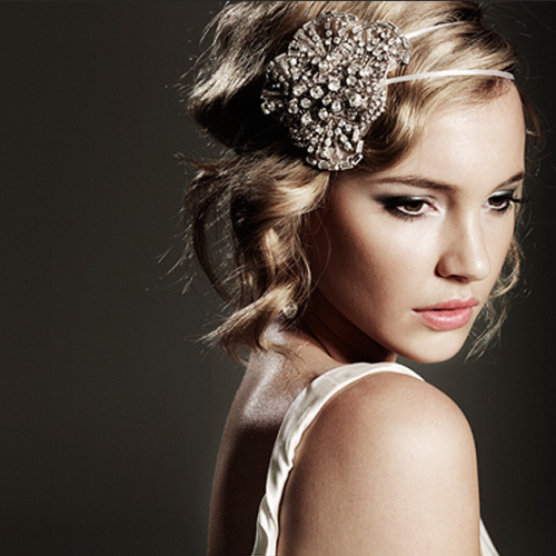 A jeweled headband adds appropriate glitter and sparkle to an elegant, understated gown. 