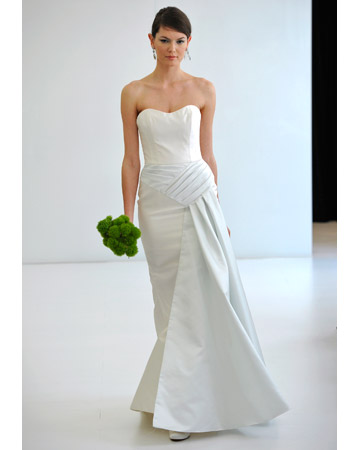 This understated gown uses a simple silhouette with fabric detailing for added interest. 